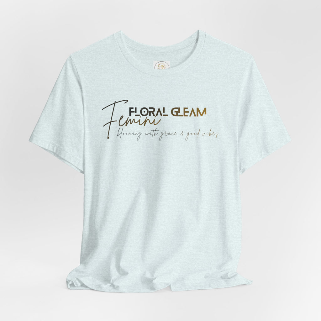 Light blue t-shirt with 'Floral Gleam Feminine' text on a light pink background