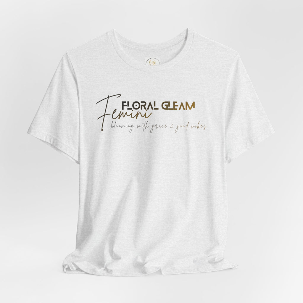 White t-shirt with 'Floral Gleam Feminine' text on a light gray background